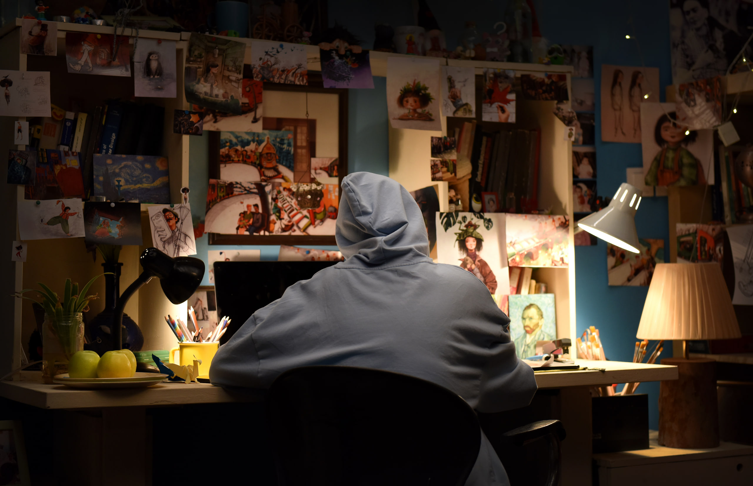 Character Scene Boy in hoodie sitting at a desk